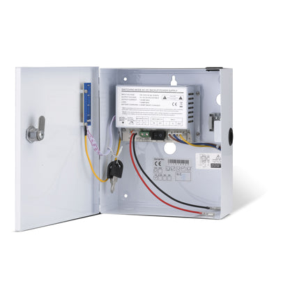 Internal view of a 12VDC boxed power supply unit showing the small enclosure, battery compartment and charging circuit