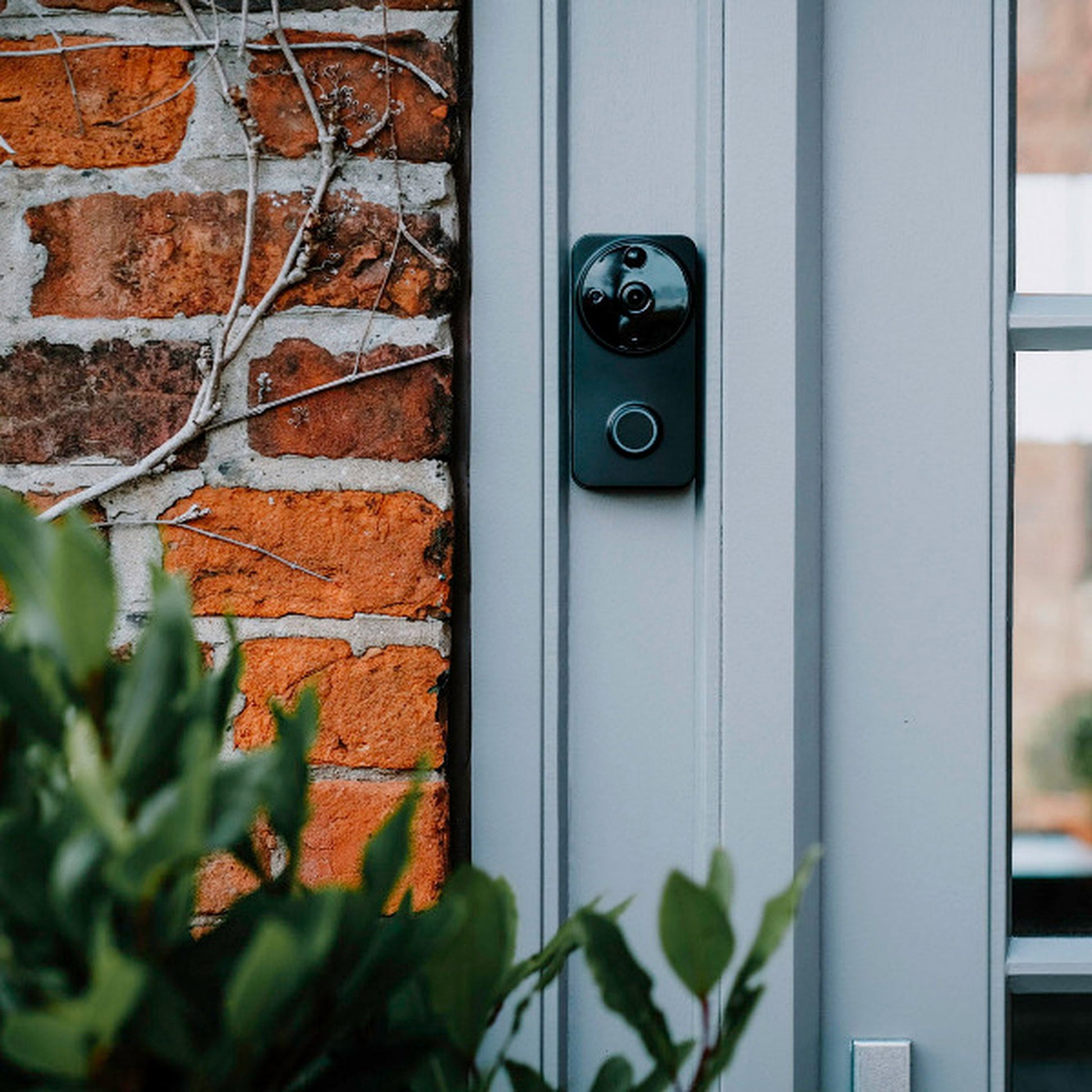 Amalock DB101 wireless video doorbell mounted to a door frame